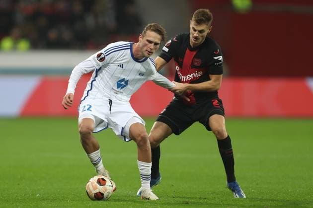 Germany, Leverkusen, 14 12 2023, BayArena, Bayer Leverkusen vs Molde FK UEFA Europa League 2023 2024 Group H, Magnus Grodem Molde FK and Josip Stanisic Bayer 04 Leverkusen battle for the ball Leverkusen BayArena North Rhine Westfalia Germany eu-images-678