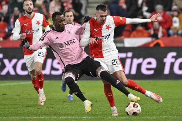 Igoh Ogbu of Servette, left, and Ivan Schranz of Slavia in action during the UEFA Europa League 6th round Group G football match Slavia Praha vs Servette Geneva in Prague, Czech Republic, December 14, 2023. (CTKxPhoto VitxSimanek) CTKPhotoP2023121408333  CTKPhotoP2023121408333