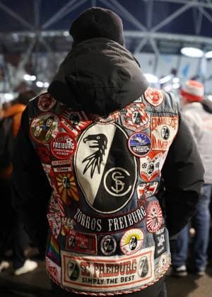 London, England, 14th December 2023. A SC Freiburg fan with patch covered jacket during the UEFA Europa League match at the London Stadium, London. Picture credit should read: David Klein Sportimage EDITORIAL USE ONLY. No use with unauthorised audio, video, data, fixture lists, club league logos or live services. Online in-match use limited to 120 images, no video emulation. No use in betting, games or single club league player publications. SPI-2801-0001