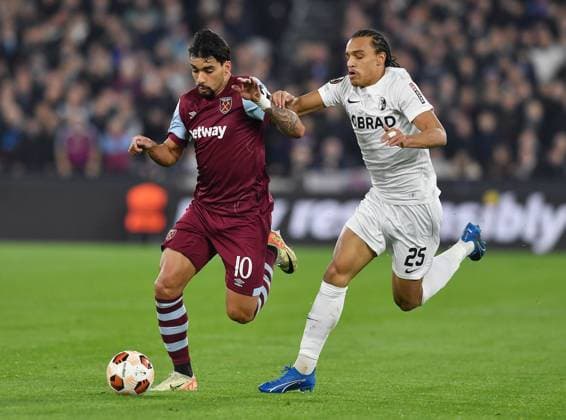 Lucas Paqueta of West Ham United is challenged by Kiliann Sildillia of SC Freiberg West Ham United v Freiburg, UEFA Europa League, Group A, Football, London Arena, London, UK - 14 Dec 2023 EDITORIAL USE ONLY No use with unauthorised audio, video, data, fixture lists, club league logos or live services. Online in-match use limited to 120 images, no video emulation. No use in betting, games or single club league player publications. Copyright: xAlanxWalter Shutterstockx 14254269v