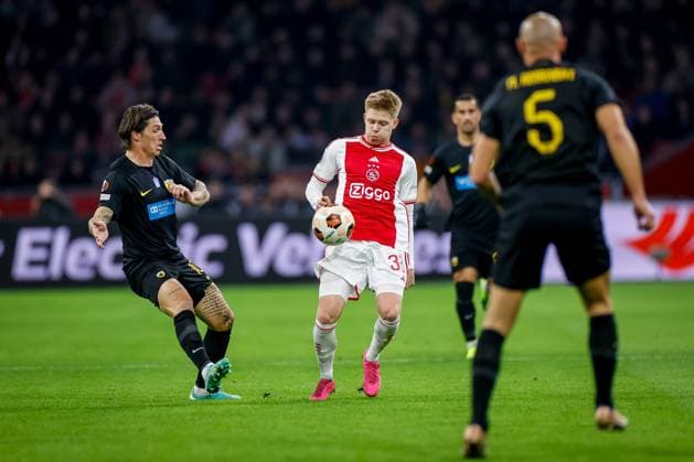 AMSTERDAM, 14-12-2023 , JohanCruyff Arena, Europa League Football season 2023 2024. Ajax player Kristian Hlynsson (r) with AEK Athene player Steven Zuber (l) during the match Ajax - AEK Athens. Ajax - AEK Athens  x23520828x Copyright: