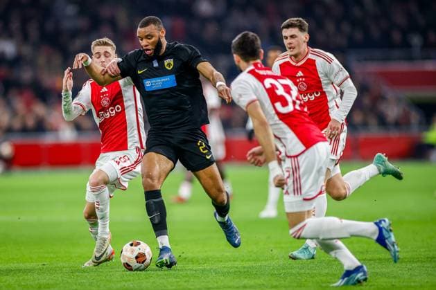 AMSTERDAM, 14-12-2023 , JohanCruyff Arena, Europa League Football season 2023 2024. Ajax player Kenneth Taylor (l) with AEK Athene player Harold Moukoudi (r) during the match Ajax - AEK Athens. Ajax - AEK Athens  x23520841x Copyright: