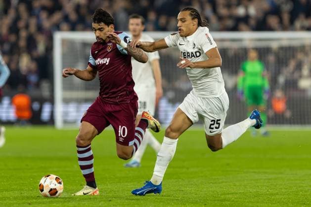Football - 2023 2023 UEFA Europa League - Group A - Match Day Six Six - West Ham United vs SC Freiburg - London Stadium - Thursday 14th December 2023. Lucas Paqueta (West Ham United) breaks away from Kiliann Sildillia (SC Freiburg) at The London Stadium COLORSPORT DANIEL BEARHAM  csp_whu_fre_db_14122023_