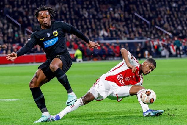 AMSTERDAM, 14-12-2023 , JohanCruyff Arena, Europa League Football season 2023 2024. AEK Athene player Levi Garcia (l) with Ajax player Jorrel Hato (r) during the match Ajax - AEK Athens. Ajax - AEK Athens  x23520902x Copyright: