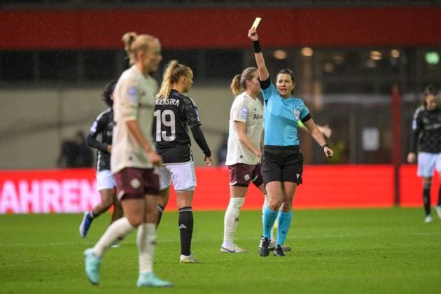 Soccer, UEFA Womens Champions League, 20231214, FC Bayern Munich Ajax Amsterdam In the picture Tiny HOEKSTRA Ajax Amsterdam, 19 sees yellow card Referee Kateryna MONZUL UKR Munich FC Bayern Campus Bayern Germany Copyright: Passion2Press MarkusxFischerx