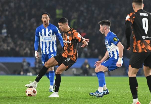 Amine Harit of Marseille and Billy Gilmour of Brighton during the Group B - UEFA Europa League 2023 24 match between Brighton & Hove Albion and Marseille at the American Express Stadium, Brighton UK -14th December 2023 Brighton v UEFA Europa League Football, Amex Stadium, Brighton, Sussex, United Kingdom - 14 Dec 2023 Editorial use only. No merchandising. For Football images FA and Premier League restrictions apply inc. no internet mobile usage without FAPL license - for details contact Football Dataco  Copyright: xLizxFinlayson TPI Shutterstockx 14258351f