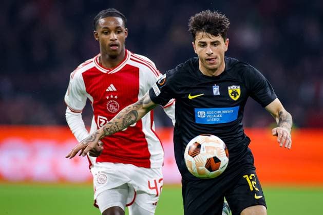 AMSTERDAM, 14-12-2023 , JohanCruyff Arena, Europa League Football season 2023 2024. AEK Athene player Lazaros Rota (r) and Ajax player Ar Jany Martha (l) during the match Ajax - AEK Athens. Ajax - AEK Athens  x23521672x Copyright: