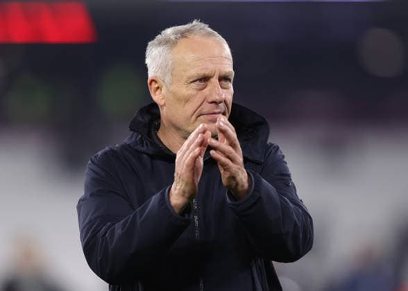 London, England, 14th December 2023. Christian Streich coach of SC Freiburg applauds their fans during the UEFA Europa League match at the London Stadium, London. Picture credit should read: David Klein Sportimage EDITORIAL USE ONLY. No use with unauthorised audio, video, data, fixture lists, club league logos or live services. Online in-match use limited to 120 images, no video emulation. No use in betting, games or single club league player publications. SPI-2801-0053