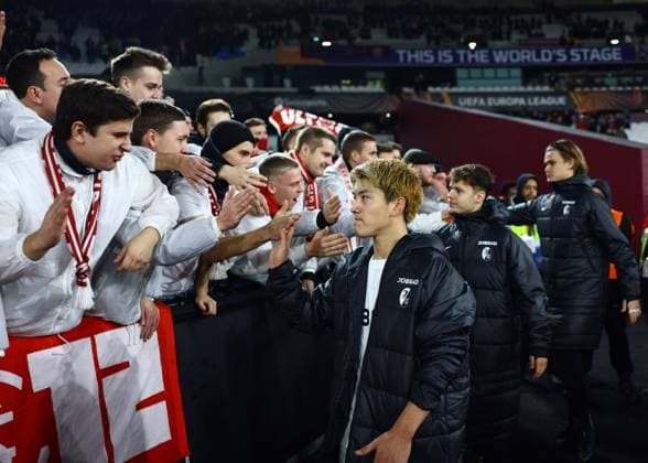 London, England, 14th December 2023. Ritsu Doan of SC Freiburg thanks the fans at th end of the match during the UEFA Europa League match at the London Stadium, London. Picture credit should read: David Klein Sportimage EDITORIAL USE ONLY. No use with unauthorised audio, video, data, fixture lists, club league logos or live services. Online in-match use limited to 120 images, no video emulation. No use in betting, games or single club league player publications. SPI-2801-0056