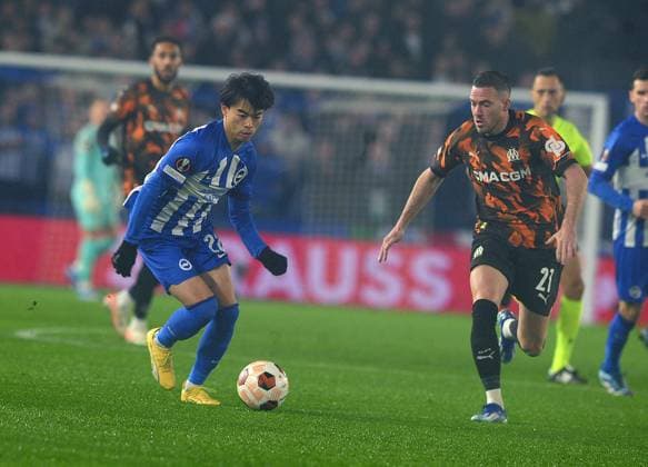 Football - 2023 2024 UEFA Europa League - Group B - Match day Six Six - Brighton & Hove Albion vs Marseille - Amex Stadium - Thursday 14th December 2023. Kaoru Mitoma of Brighton and Jordan Veretout of Marseille 