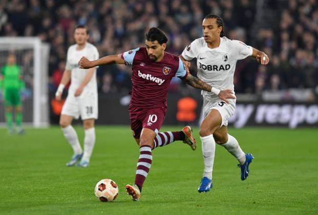 Lucas Paqueta of West Ham United in action with Kiliann Sildillia of Freiburg West Ham United v Freiburg, UEFA Europa League, Group A, Football, London Arena, London, UK - 14 Dec 2023 EDITORIAL USE ONLY No use with unauthorised audio, video, data, fixture lists, club league logos or live services. Online in-match use limited to 120 images, no video emulation. No use in betting, games or single club league player publications. Copyright: xAlanxWalter Shutterstockx 14254269cj