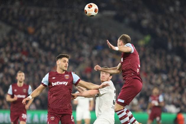 Konstantinos Mavropanos and Vladimir Coufal of West Ham United and Michael Gregoritsch of SC Freiburg compete for the ball during the UEFA Europa League match between West Ham United and SC Freiburg at the London Stadium, Queen Elizabeth Olympic Park , London, England on 14 December 2023. Copyright: xJoshuaxSmithx 39250023