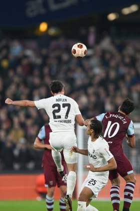 Nicholas Hofler of SC Freiburg and Lucas Paqueta of West Ham United challenge for the high ball during the UEFA Europa League match between West Ham United and SC Freiburg at the London Stadium, Queen Elizabeth Olympic Park , London, England on 14 December 2023. Copyright: xPhilxHutchinsonx 39240055