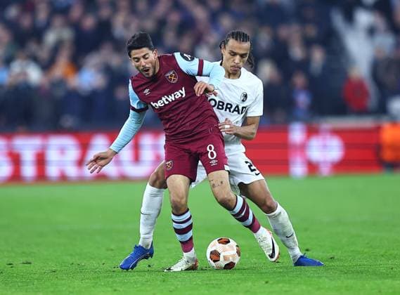 Pablo Fornals of West Ham United and Kiliann Sildillia of SC Freiburg West Ham United v Freiburg, UEFA Europa League, Group A, Football, London Arena, London, UK - 14 Dec 2023 EDITORIAL USE ONLY No use with unauthorised audio, video, data, fixture lists, club league logos or live services. Online in-match use limited to 120 images, no video emulation. No use in betting, games or single club league player publications. Copyright: xMichaelxZemanek Shutterstockx 14254605ew