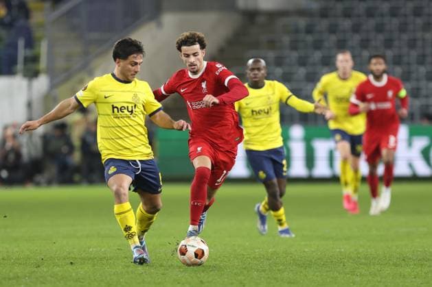 231214 Royale Union Saint-Gilloise vs Liverpool FC Curtis Jones of Liverpool battles for the ball with Kevin Mac Allister of Union during a football game between Royale Union Saint-Gilloise and Liverpool FC on day 6 in Group E of the UEFA Europa League season 2023-2024 competition on December 14, 2023 in Brussels, Belgium. (Photo by Frank Abbeloos Isosport) BRUSSELS BELGIUM  Copyright: xx 424930