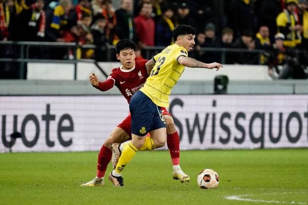 Cameron Puertas of Royal Union Saint-Gilloise takes on Wataru Endo of Liverpool Union Saint-Gilloise v Liverpool, UEFA Europa League, Group E, Football, Lotto Park, Brussels, Belgium - 14 Dec 2023 EDITORIAL USE ONLY No use with unauthorised audio, video, data, fixture lists, club league logos or live services. Online in-match use limited to 120 images, no video emulation. No use in betting, games or single club league player publications. Copyright: xDavexWinter Shutterstockx 14254246fb