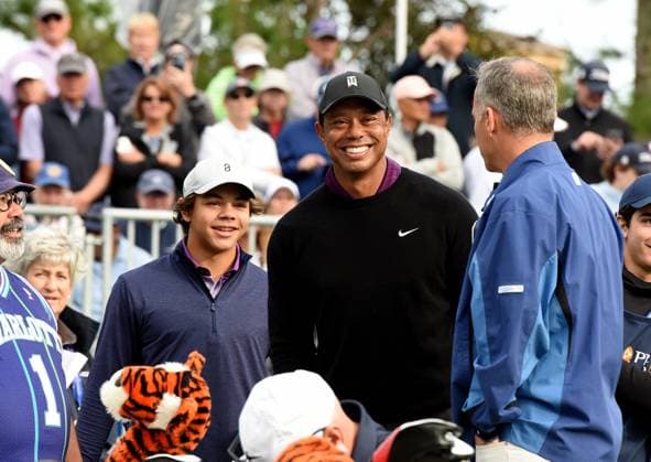 December 15, 2023, Orlando, Florida, United States: Tiger Woods and his son, Charlie Woods, share a laugh before teeing off on the first hole of the Pro-Am at the PNC Championship golf tournament at the Ritz-Carlton Golf Club. Orlando United States - ZUMAs197 20231215_aab_s197_061 Copyright: xPaulxHennessyx