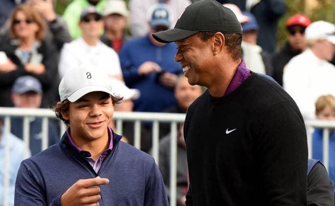 December 15, 2023, Orlando, Florida, United States: Tiger Woods and his son, Charlie Woods, share a laugh before teeing off on the first hole of the Pro-Am at the PNC Championship golf tournament at the Ritz-Carlton Golf Club. Orlando United States - ZUMAs197 20231215_aab_s197_064 Copyright: xPaulxHennessyx
