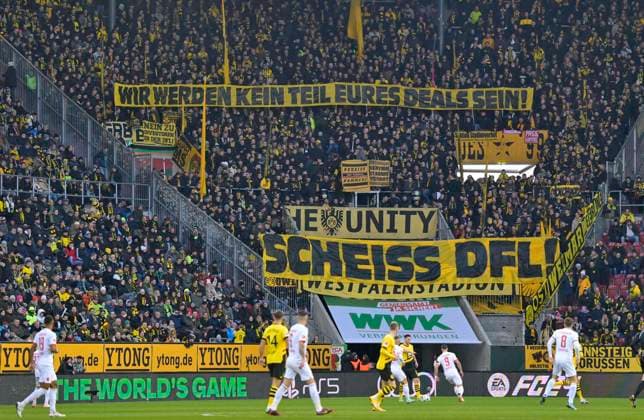 Bilder des Jahres 2023, Sport 12 Dezember Sport Themen der Woche KW50 Sport Bilder des Tages 16.12.2023, Fussball 1. Bundesliga 2023 2024, 15.Spieltag, FC Augsburg - Borussia Dortmund, in der WWK-Arena Augsburg, wir werden kein Teil eures Deals sein - Scheiss DFL, das finden die Dortmunder Fans ***DFL and DFB regulations prohibit any use of photographs as image sequences and or quasi-video.*** *** 16 12 2023, Soccer 1 Bundesliga 2023 2024, 15 Matchday, FC Augsburg Borussia Dortmund, in the WWK Arena Augsburg, we will not be part of your deal Scheiss DFL, thats what the Dortmund fans think DFL and DFB regulations prohibit any use of photographs as image sequences and or quasi video