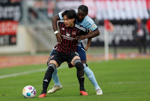 Image Daichi Hayashi 1 FC Nuernberg, 9 and Stephan Ambrosius Hamburger SV l r 16 12 2023, Football, 2 Bundesliga, 1 FC Nürnberg Hamburger SV, GER, Nuernberg, Max Morlock Stadion, DFL REGULATIONS PROHIBIT ANY USE OF PHOTOGRAPHS AS IMAGE SEQUENCES AND OR QUASI VIDEO Copyright: HMBxMedia xHeikoxBecker