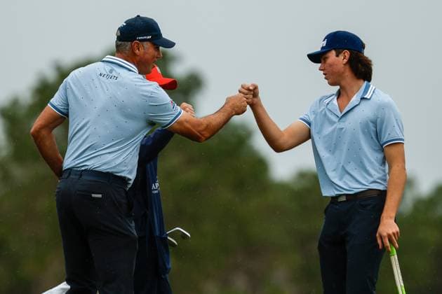 December 16, 2023: Matt Kuchar and son Cameron Kuchar fist bump after the 18th hole during Round One of the PNC Championship golf tournament at the Ritz-Carlton Golf Club in Orlando, Florida. CSM Orlando United States of America - ZUMAc04_ 20231216_zma_c04_174 Copyright: xDarrenxLeex