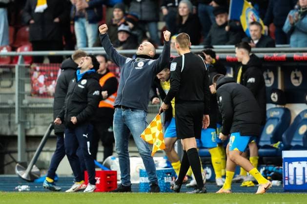 Coach Daniel Scherning Eintracht Braunschweig cheers at the final whistle 2 Soccer Bundesliga Season 2023 2024 Eintracht Braunschweig vs 1 FC Kaiserslautern at Eintracht Stadium in Braunschweig Soccer,Man,Men,Germany,17 12 2023