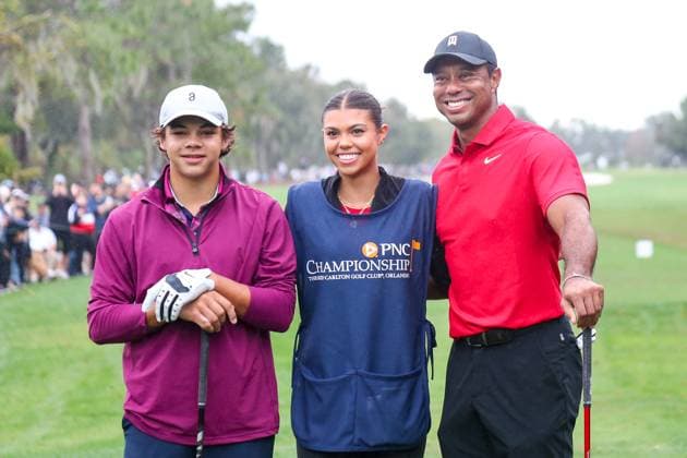December 17, 2023, Orlando, Florida, USA: (L-R) Charlie Woods, Samanth Woods and Tiger Woods pose for photos on the first tee during the final round of the 2023 PNC Championship at Ritz-Carlton Golf Club. Orlando USA - ZUMAw109 20231217_fap_w109_004 Copyright: xDebbyxWongx