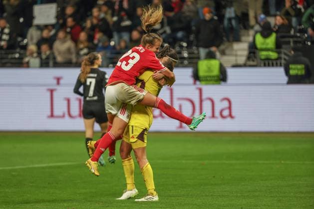 UWCL Eintracht Frankfurt Benfica Lisbon on 21 12 2023 at Deutsche Bank Park in Frankfurt Anna Gasper Benfica Lisbon 23 jumps on Lena Pauels Benfica Lisbon 1 and cheers MH
