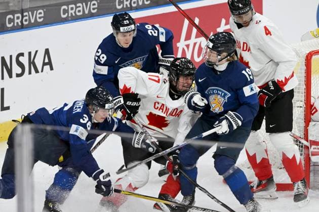 Janne Naukkarinen (L, 36), Lenni Hämeenaho (29) and Konsta Helenius (19) of Finland vie with Macklin Celebrini (17) and Noah Warren (4) of Canada during the Ice hockey, Eishockey 2024 IIHF World Junior U20 Championship tournament match between Finland and Canada in Gothenburg, Sweden, on December 26, 2023. Gothenburg Sweden LKFTJK20231226155608UJZW  Copyright: xJussixNukarix LKFTJK20231226155608UJZW