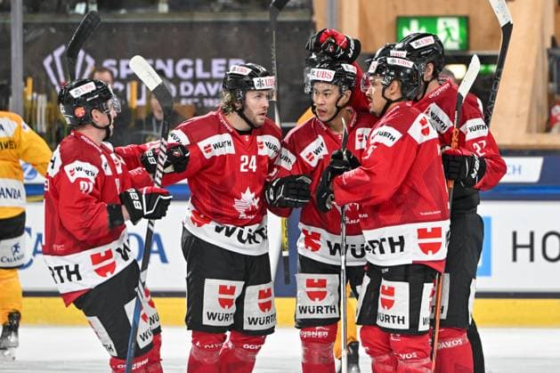 29 12 2023, Davos, Eisstadion Davos, Spengler Cup Team Canada KalPa Kuopio, 21 Jonathan Ang Team Canada celebrate his goal with 24 Ty Smith Team Canada and 9 Michael Joly Team Canada Davos Eisstadion Davos Graubünden Switzerland Copyright: xJustPictures.ch AndreaxBrancax jp-en-AnBr-AB_29122023_AAB_9997