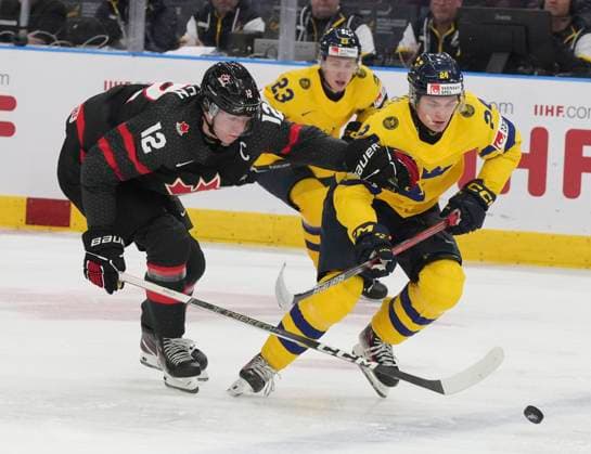 December 29, 2023, GOTHENBURG, SWEDEN: Sweden s Tom Willander (24) and Canada s Fraser Minten (12) battle for the puck during second period action at the IIHF World Junior Hockey Championship in Gothenburg, Sweden, Friday, Dec. 29, 2023. Canada News - December 29, 2023  - ZUMAc35_ 20231229_zaf_c35_054 Copyright: xChristinnexMuschix