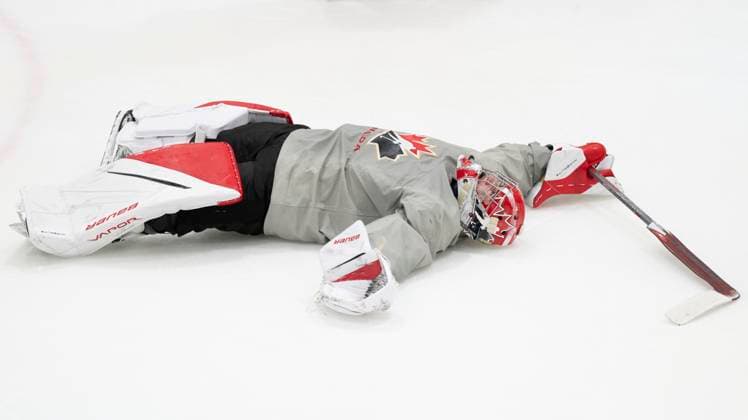 December 30, 2023, GOTHENBURG, SWEDEN: Canada goaltender Scott Ratzlaff lies on the ice following a practice session at the IIHF World Junior Hockey Championship in Gothenburg, Sweden on Saturday, Dec. 30, 2023. Canada News - December 30, 2023  - ZUMAc35_ 20231230_zaf_c35_002 Copyright: xChristinnexMuschix