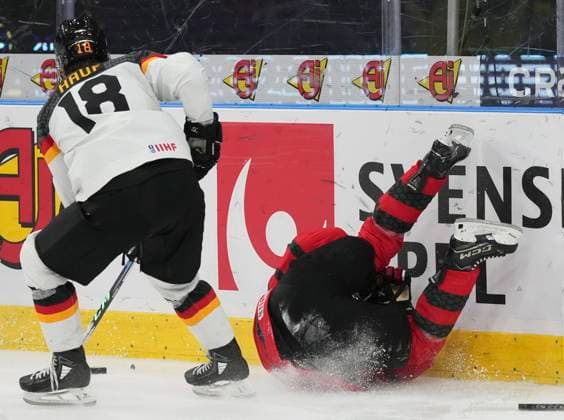December 31, 2023, GOTHENBURG, SWEDEN: Canada s Matthew Poitras (15) is checked into the boards by Germany s Luca Hauf (18) during second period hockey action at the IIHF World Junior Hockey Championship in Gothenburg, Sweden, Sunday, Dec. 31, 2023. Canada News - December 31, 2023  - ZUMAc35_ 20231231_zaf_c35_011 Copyright: xChristinnexMuschix