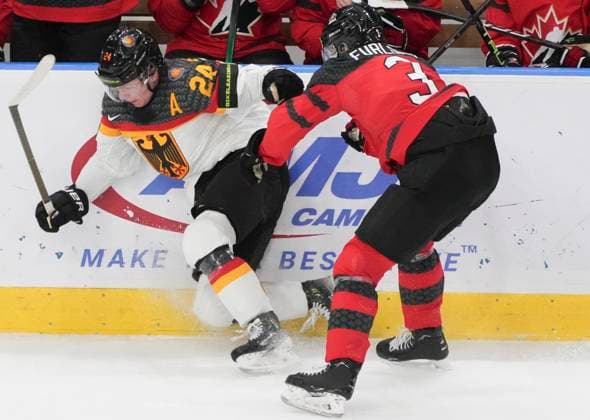 December 31, 2023, GOTHENBURG, SWEDEN: Canada s Jake Furlong (3) checks Germany s Roman Kechter (24) into the boards during third period hockey action at the IIHF World Junior Hockey Championship in Gothenburg, Sweden, Sunday, Dec. 31, 2023. Canada News - December 31, 2023  - ZUMAc35_ 20231231_zaf_c35_018 Copyright: xChristinnexMuschix