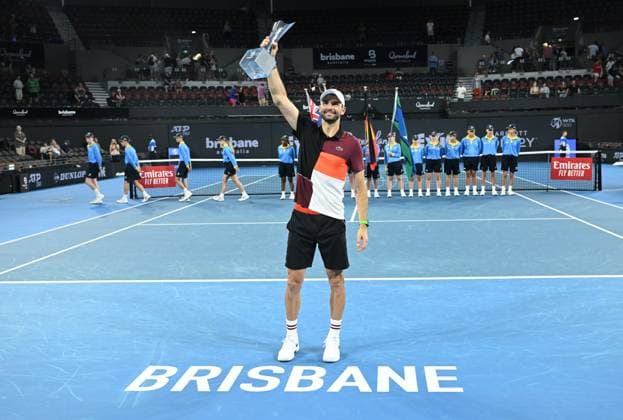 TENNIS BRISBANE INTERNATIONAL, Grigor Dimitrov of Bulgaria celebrates winning with the trophy after winning the men?s Final against Holger Rune of Denmark on Day 8 of the 2024 Brisbane International at the Queensland Tennis Centre in Brisbane, Sunday, January 7, 2024. ( NO ARCHIVING, EDITORIAL USE ONLY, NO USE IN BOOKS WITHOUT CONSENT BRISBANE QUEENSLAND AUSTRALIA  Copyright: xDARRENxENGLANDx 20240107001885883086