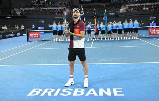 TENNIS BRISBANE INTERNATIONAL, Grigor Dimitrov of Bulgaria celebrates winning with the trophy after winning the men?s Final against Holger Rune of Denmark on Day 8 of the 2024 Brisbane International at the Queensland Tennis Centre in Brisbane, Sunday, January 7, 2024. ( NO ARCHIVING, EDITORIAL USE ONLY, NO USE IN BOOKS WITHOUT CONSENT BRISBANE QUEENSLAND AUSTRALIA  Copyright: xDARRENxENGLANDx 20240107001885883229