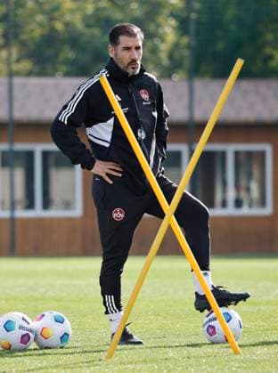 08 01 2024 Soccer 2 Soccer Bundesliga Season 2023 2024 1 FC Nuremberg FCN Club Training Camp Winter Winter Training Camp Marbella Spain Sports Photo Zinc DaMa xdaxmax Cristian Fiel Coach 1 FC Nuremberg FCN thoughtfully puts foot on the ball and watches team team during training session Exercise