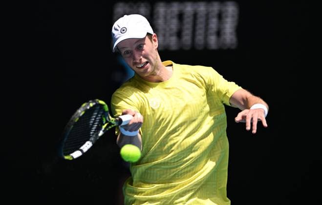 TENNIS AUSTRALIAN OPEN, Botic van de Zandschulp of Netherlands returns to Jannik Sinner of Italy during their first round match on Day 1 of the 2024 Australian Open at Melbourne Park in Melbourne, Sunday, January 14, 2024. ( NO ARCHIVING, EDITORIAL USE ONLY, NO USE IN BOOKS WITHOUT CONSENT MELBOURNE VICTORIA AUSTRALIA  Copyright: xLUKASxCOCHx 20240114001888717688