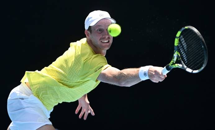 TENNIS AUSTRALIAN OPEN, Botic van de Zandschulp of Netherlands returns during his first round match against Jannik Sinner of Italy on Day 1 of the 2024 Australian Open at Melbourne Park in Melbourne, Sunday, January 14, 2024. ( NO ARCHIVING, EDITORIAL USE ONLY, NO USE IN BOOKS WITHOUT CONSENT MELBOURNE VICTORIA AUSTRALIA  Copyright: xLUKASxCOCHx 20240114001888729153