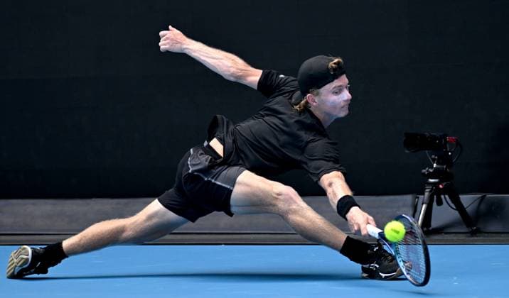TENNIS AUSTRALIAN OPEN, Dane Sweeny of Australia stretches to return during his first round match against Francisco Cerundolo of Argentina on Day 1 of the 2024 Australian Open at Melbourne Park in Melbourne, Sunday, January 14, 2024. ( NO ARCHIVING, EDITORIAL USE ONLY, NO USE IN BOOKS WITHOUT CONSENT MELBOURNE VICTORIA AUSTRALIA  Copyright: xJAMESxROSSx 20240114001888729949