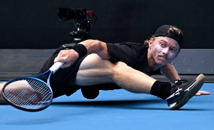 TENNIS AUSTRALIAN OPEN, Dane Sweeny of Australia stretches to return during his first round match against Francisco Cerundolo of Argentina on Day 1 of the 2024 Australian Open at Melbourne Park in Melbourne, Sunday, January 14, 2024. ( NO ARCHIVING, EDITORIAL USE ONLY, NO USE IN BOOKS WITHOUT CONSENT MELBOURNE VICTORIA AUSTRALIA  Copyright: xJAMESxROSSx 20240114001888730883