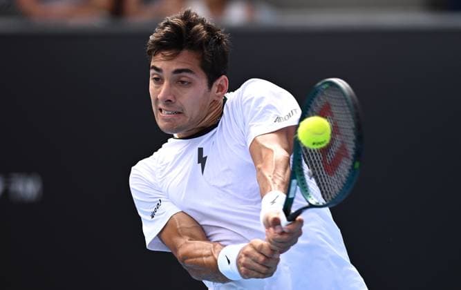 TENNIS AUSTRALIAN OPEN, Cristian Garin of Chile returns during his first round match against Christopher O?Connell of Australia on Day 1 of the 2024 Australian Open at Melbourne Park in Melbourne, Sunday, January 14, 2024. ( NO ARCHIVING, EDITORIAL USE ONLY, NO USE IN BOOKS WITHOUT CONSENT MELBOURNE VICTORIA AUSTRALIA  Copyright: xJOELxCARRETTx 20240114001888766078