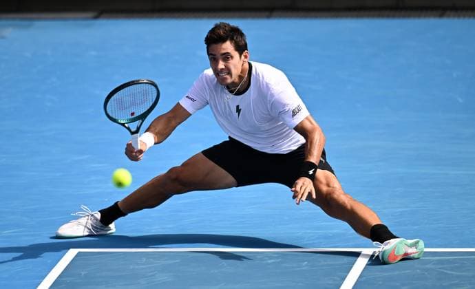 TENNIS AUSTRALIAN OPEN, Cristian Garin of Chile returns during his first round match against Christopher O?Connell of Australia on Day 1 of the 2024 Australian Open at Melbourne Park in Melbourne, Sunday, January 14, 2024. ( NO ARCHIVING, EDITORIAL USE ONLY, NO USE IN BOOKS WITHOUT CONSENT MELBOURNE VICTORIA AUSTRALIA  Copyright: xJOELxCARRETTx 20240114001888772076