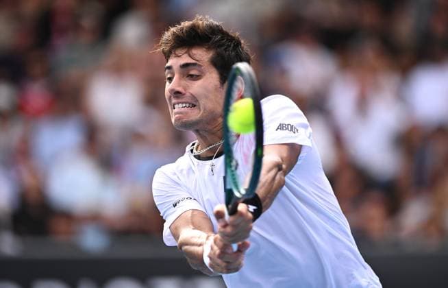 TENNIS AUSTRALIAN OPEN, Cristian Garin of Chile returns during his first round match against Christopher O?Connell of Australia on Day 1 of the 2024 Australian Open at Melbourne Park in Melbourne, Sunday, January 14, 2024. ( NO ARCHIVING, EDITORIAL USE ONLY, NO USE IN BOOKS WITHOUT CONSENT MELBOURNE VICTORIA AUSTRALIA  Copyright: xJOELxCARRETTx 20240114001888775377