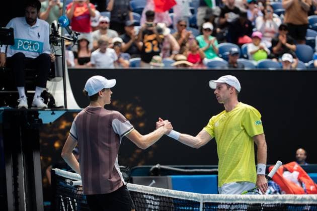 (240114) -- MELBOURNE, Jan. 14, 2024 -- Jannik Sinner (L) greets Botic Van de Zandschulp after the men s singles first round match between Jannik Sinner of Italy and Botic Van de Zandschulp of the Netherlands at the Australian Open tennis tournament in Melbourne, Australia, on Jan. 14, 2024. (Photo by Xinhua) (SP)AUSTRALIA-MELBOURNE-TENNIS-AUSTRALIAN OPEN-MEN S SINGLES HuxJingchen 