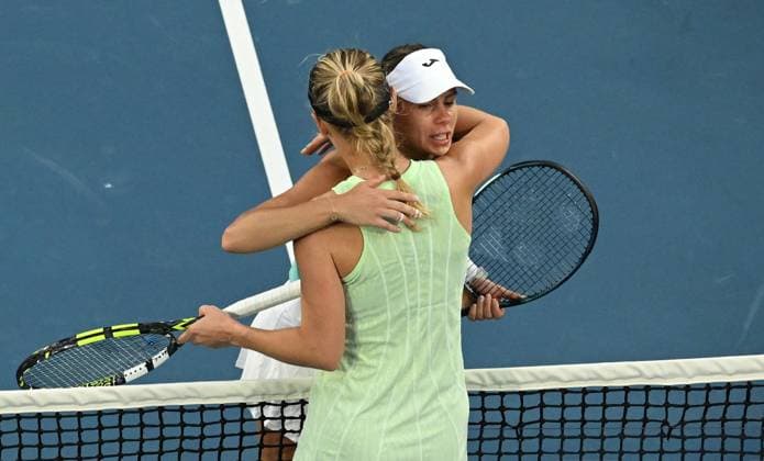 TENNIS AUSTRALIAN OPEN, Magda Linette of Poland (right) reacts with Caroline Wozniacki of Denmark after retiring from their first round match on Day 1 of the 2024 Australian Open at Melbourne Park in Melbourne, Sunday, January 14, 2024. ( NO ARCHIVING, EDITORIAL USE ONLY, NO USE IN BOOKS WITHOUT CONSENT MELBOURNE VICTORIA AUSTRALIA  Copyright: xLUKASxCOCHx 20240114001888806476