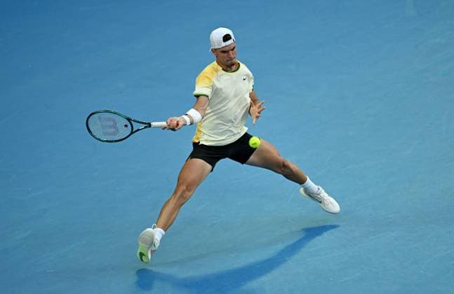 TENNIS AUSTRALIAN OPEN, Dino Prizmic of Croatia returns during his first round match against Novak Djokovic of Serbia on Day 1 of the 2024 Australian Open at Melbourne Park in Melbourne, Sunday, January 14, 2024. ( NO ARCHIVING, EDITORIAL USE ONLY, NO USE IN BOOKS WITHOUT CONSENT MELBOURNE VICTORIA AUSTRALIA  Copyright: xLUKASxCOCHx 20240114001888808537