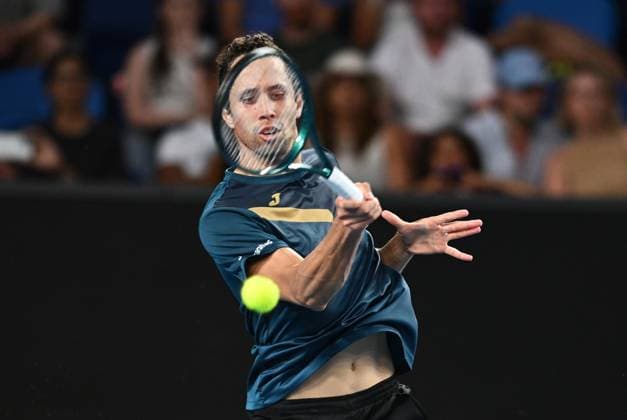 TENNIS AUSTRALIAN OPEN, Daniel Elahi Galan of Chile returns during his first round match against Jason Kubler of Australia on Day 1 of the 2024 Australian Open at Melbourne Park in Melbourne, Sunday, January 14, 2024. ( NO ARCHIVING, EDITORIAL USE ONLY, NO USE IN BOOKS WITHOUT CONSENT MELBOURNE VICTORIA AUSTRALIA  Copyright: xJOELxCARRETTx 20240114001888810805