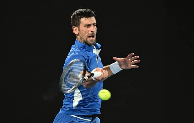 TENNIS AUSTRALIAN OPEN, Novak Djokovic of Serbia returns during his first round match against Dino Prizmic of Croatia on Day 1 of the 2024 Australian Open at Melbourne Park in Melbourne, Sunday, January 14, 2024. ( NO ARCHIVING, EDITORIAL USE ONLY, NO USE IN BOOKS WITHOUT CONSENT MELBOURNE VICTORIA AUSTRALIA  Copyright: xLUKASxCOCHx 20240114001888816220