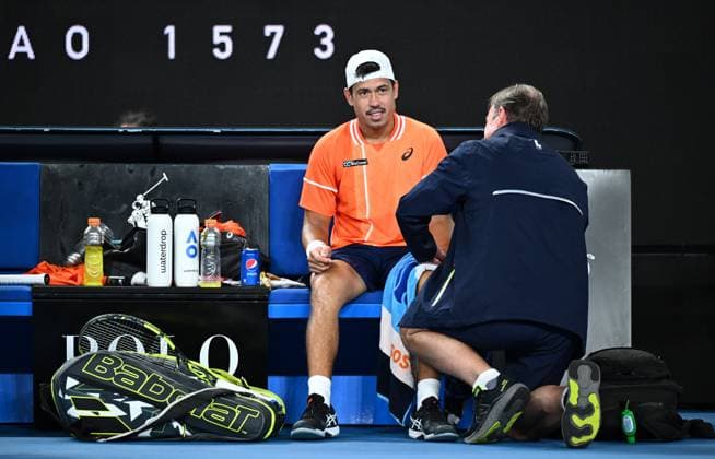 TENNIS AUSTRALIAN OPEN, Jason Kubler of Australia receives treatment during a medical time out during his first round match against Daniel Elahi Galan of Chile on Day 1 of the 2024 Australian Open at Melbourne Park in Melbourne, Sunday, January 14, 2024. ( NO ARCHIVING, EDITORIAL USE ONLY, NO USE IN BOOKS WITHOUT CONSENT MELBOURNE VICTORIA AUSTRALIA  Copyright: xJOELxCARRETTx 20240114001888856570